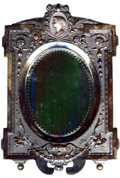 Bedside Mirror. This has the heavy wooden back typical of a Bois Durci Bedside Mirror.