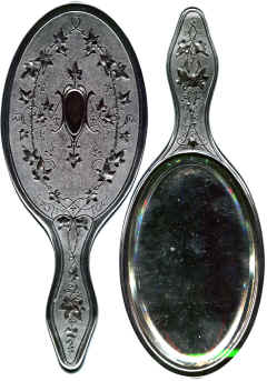 Hand Mirror, Very glossy and black. Unusually thick and heavy for a Hand Mirror. Quite unlike the Shellac mirrors. Probably too heavy to be practical.