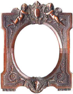 A large frame to hold a mirror. A metal hook indicates that this mirror was intended to be hung from a wall. This is moulded with brown Bois Durci at the front and black Bois Durci at the back.