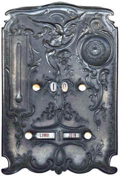 Calendar. Dials are enamel. there is also an English version. A watch hangs on the hook within the circular recess. The thermometer is missing.