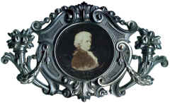 Frame. Small holes for nails indicate that this frame was meant to be attached to furniture, probably a Piano.