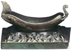 Vide Poche. This object stands by the bed to take the contents of trouser pockets. The Gondola is made from Spelter.