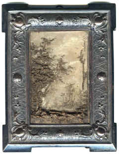 Frame for ceramic sculpture. This frame seemingly designed for its present contents. Hold a ceramic tile portraying a landscape. Signed and dated '83.