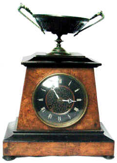 Clock. This clock has a Bois Durci Dish mounted on top, and a Bois Durci moulded inner dial.