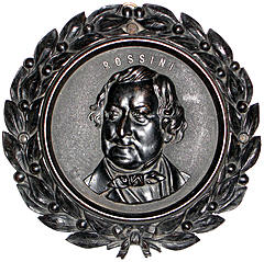 Later three quarter facing portrait. Back unmarked with slight circular recess.
