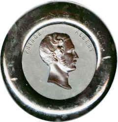 Mounted within a black painted wood collar. Back has usual 'BOIS DURCI' mark.