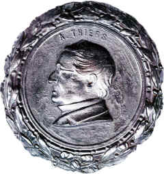 Late resin moulding with erased? marking 'T.I.S' within dished recess. Portrait seems worn.