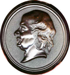 Same portrait as the plaque but seems to be the lid of the jar with the rim removed?