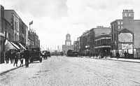 East India Dock Road, showing the dock gateway in the distance. By William Whiffin